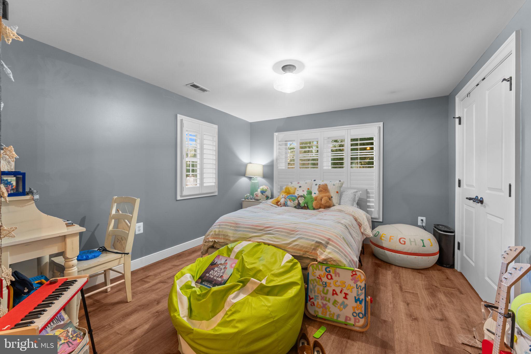 23375 Potts Mill Road Middleburg, VA 20117 - Photo 23 of 48 a bedroom with a bed and wooden floor