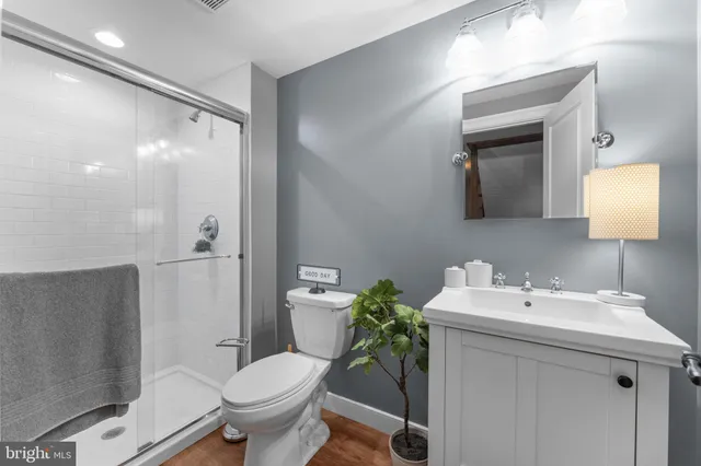 a bathroom with a sink toilet and shower