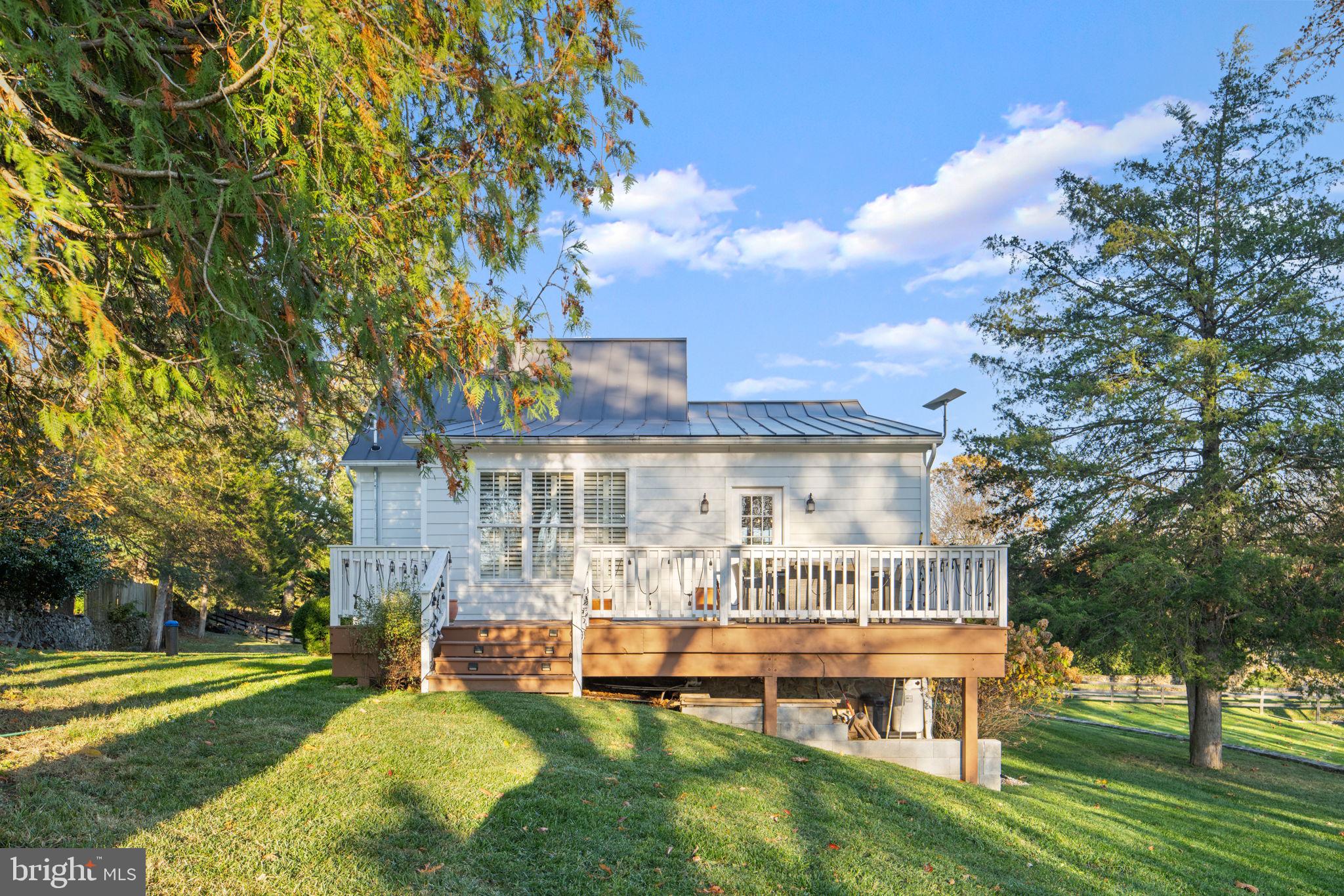 23375 Potts Mill Road Middleburg, VA 20117 - Photo 29 of 48 a view of a house with a big yard and large trees