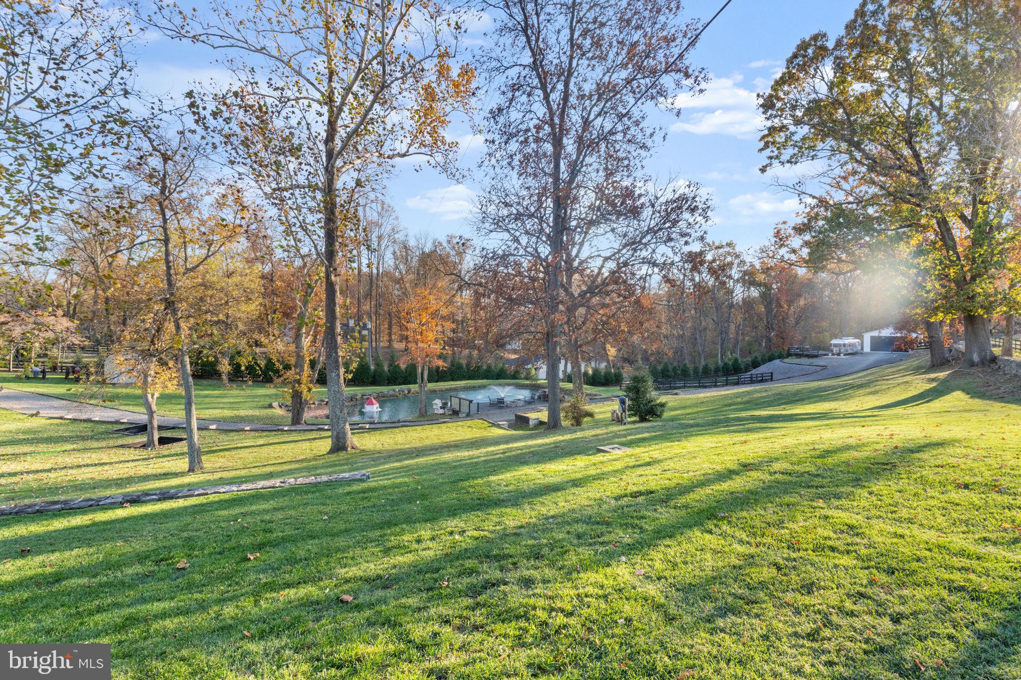 23375 Potts Mill Road Middleburg, VA 20117 - Photo 30 of 48 a view of a playground with a swimming pool
