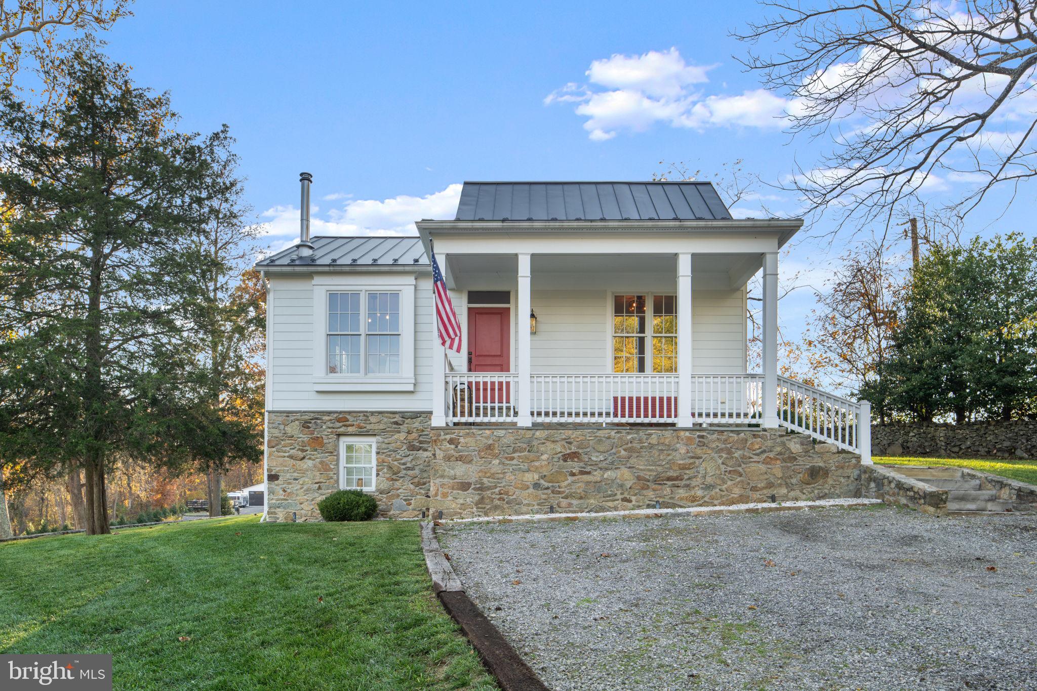 23375 Potts Mill Road Middleburg, VA 20117 - Photo 3 of 48 a view of a white house with a large tree