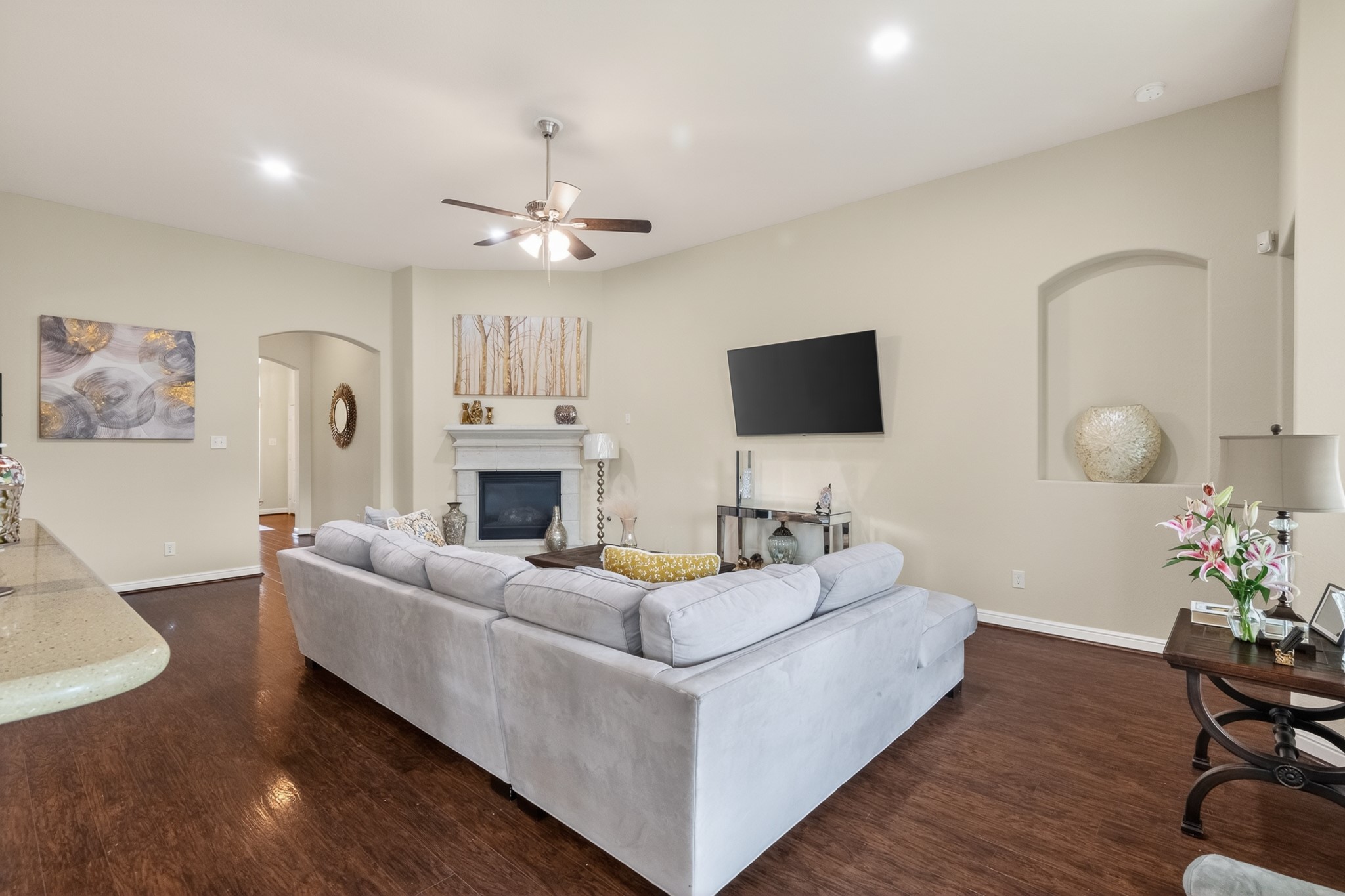24711 East Burnaby Circle Spring, TX 77373 - Photo 5 of 20 a living room with fireplace furniture and a flat screen tv