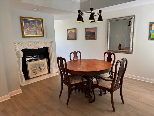 a dining room with furniture and window
