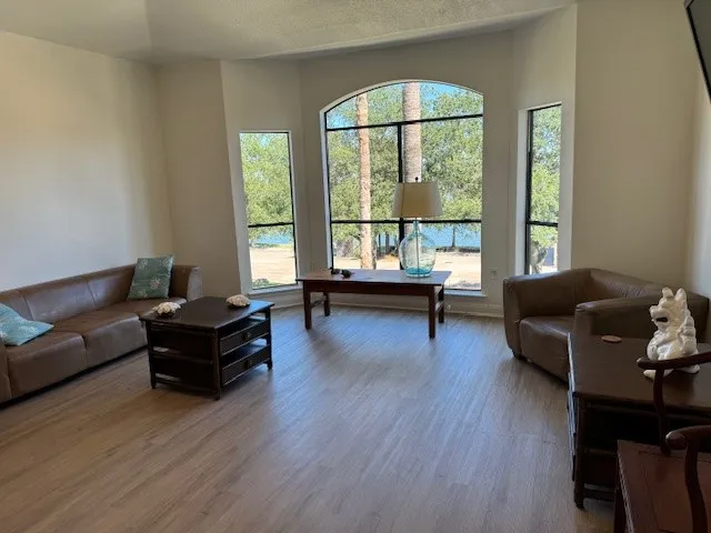 a dining room with furniture and wooden floor