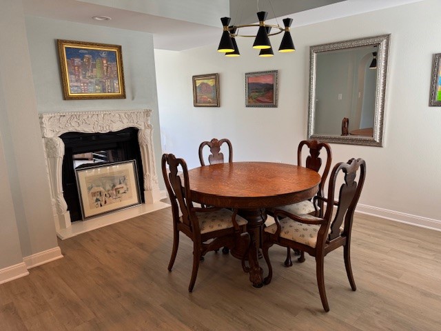 517 Mariners Drive Kemah, TX 77565 - Photo 20 of 26 a dining room with furniture and wooden floor