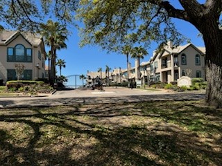 517 Mariners Drive Kemah, TX 77565 - Photo 2 of 26 a view of road with large trees