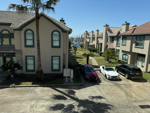 517 Mariners Drive Kemah, TX 77565 - Photo 10 of 26 a car parked in front of a brick house