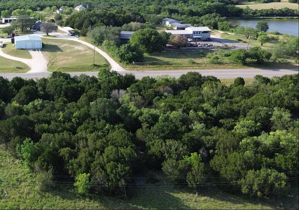 1129 County Road Nemo, TX 76070 - Photo 9 of 29 a view of yard with outdoor seating and lake view