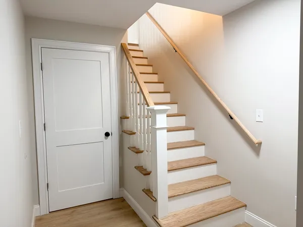 a view of entryway with wooden floor and stairs