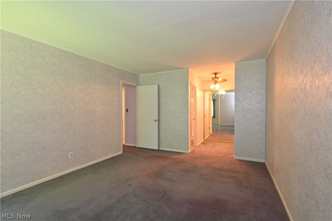 22962 Maple Ridge Road, Unit 206 North Olmsted, OH 44070 - Photo 12 of 33 Unfurnished room with a textured ceiling and carpet flooring