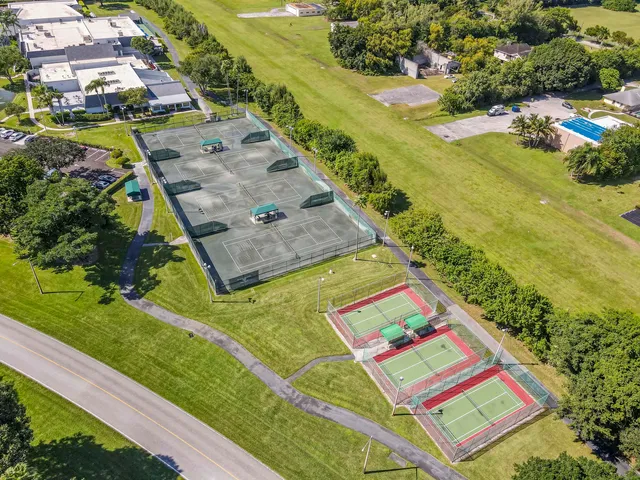 an aerial view of a house with outdoor space