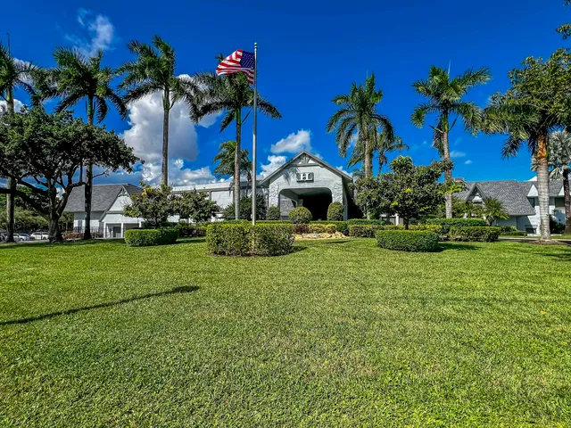 a view of multiple houses with a yard