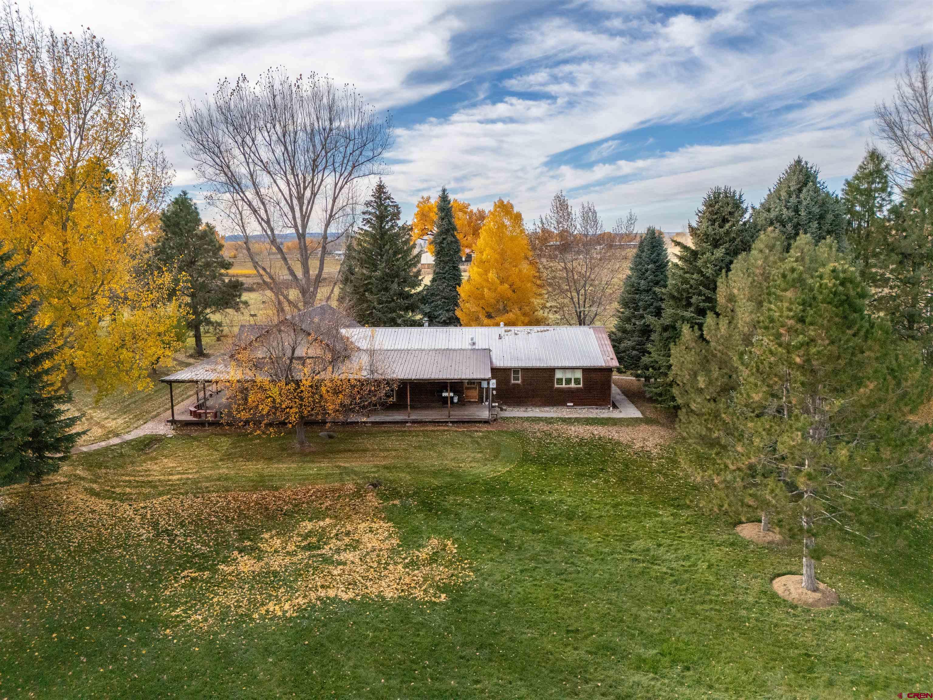 24620 Rd North Cortez, CO 81321 - Photo 11 of 40 a aerial view of a house with a yard basket ball court and outdoor seating