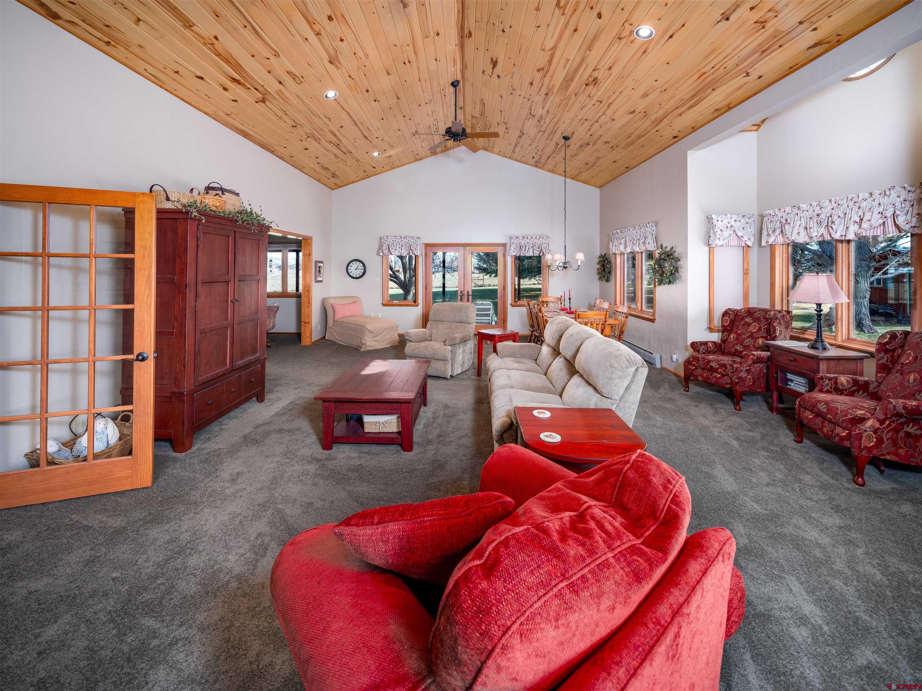24620 Rd North Cortez, CO 81321 - Photo 14 of 40 a living room with furniture a ceiling fan and a rug