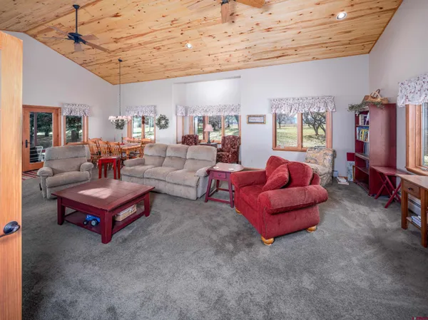 a bedroom with a bed and a table