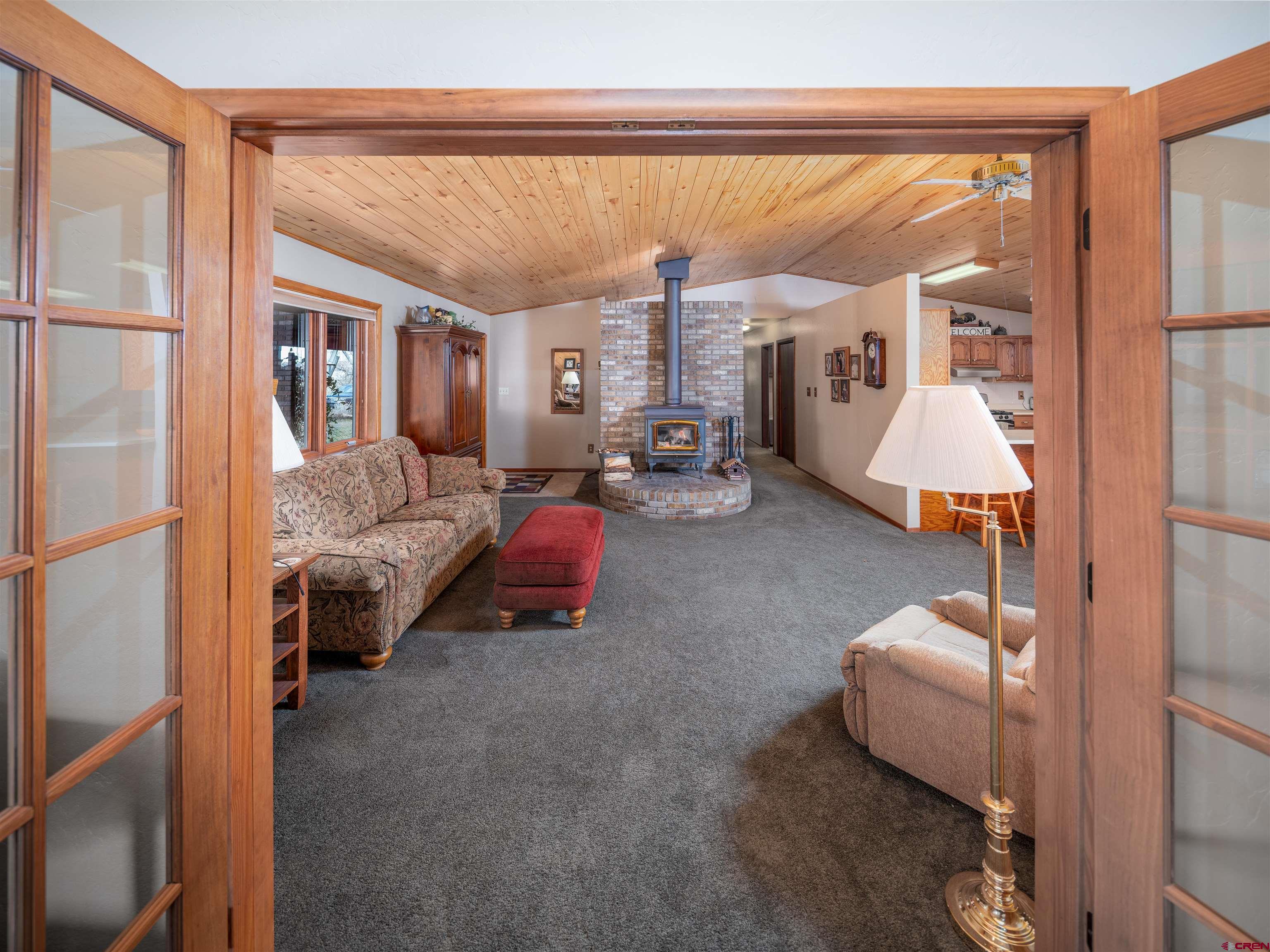 24620 Rd North Cortez, CO 81321 - Photo 17 of 40 a living room with furniture and a large window