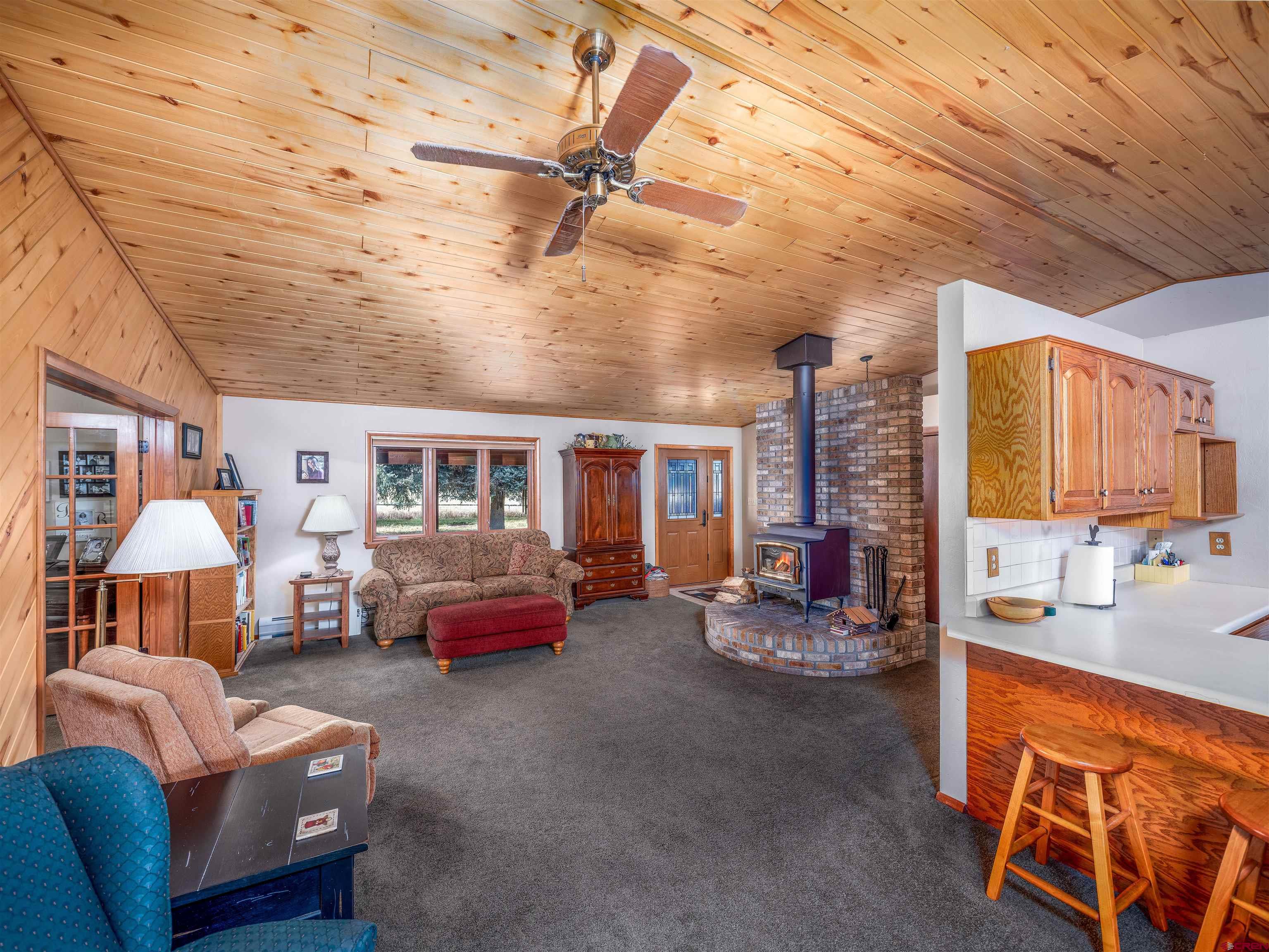 24620 Rd North Cortez, CO 81321 - Photo 18 of 40 a living room with furniture a couch and a window