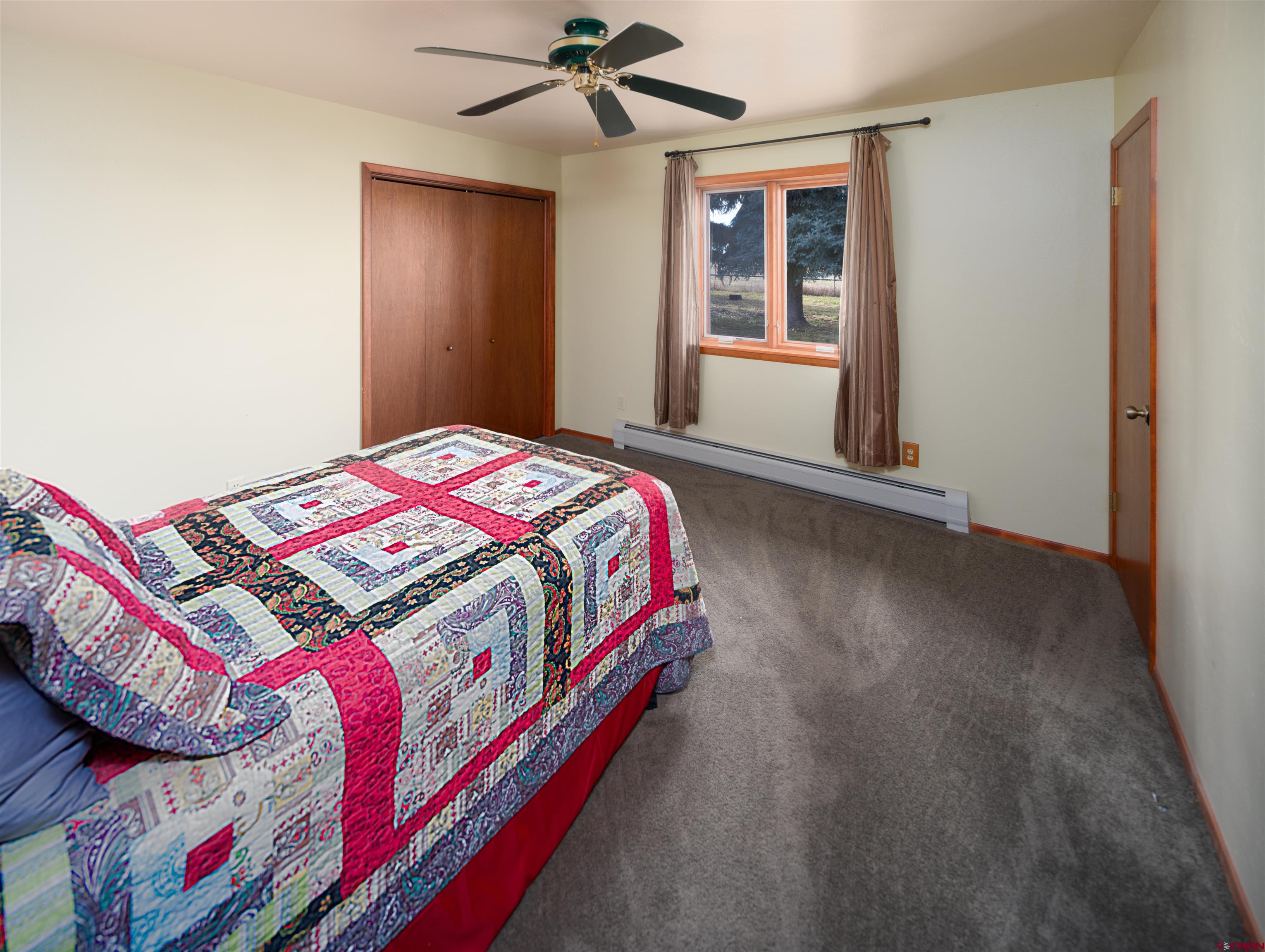 24620 Rd North Cortez, CO 81321 - Photo 23 of 40 a bedroom with a bed and a window