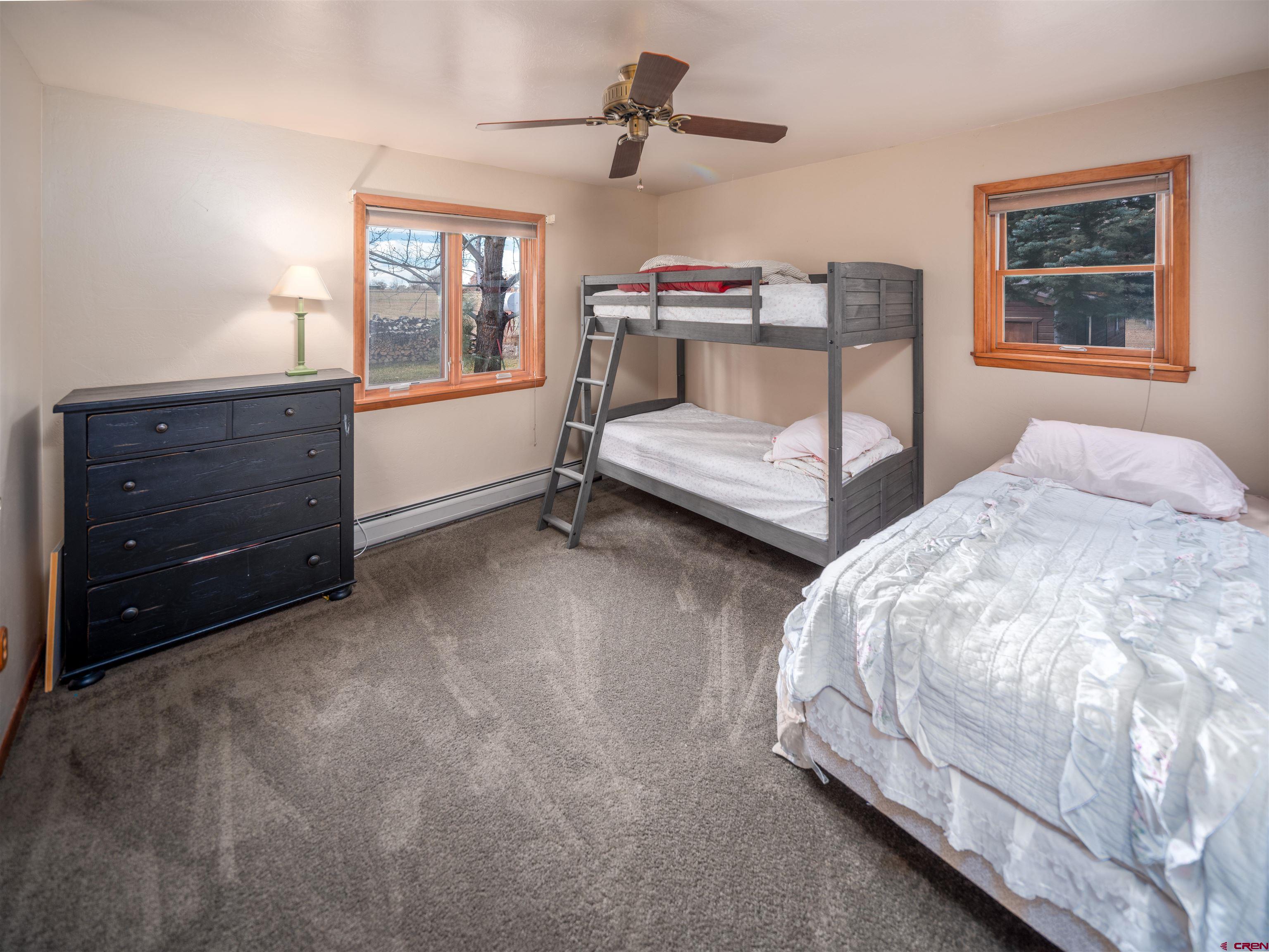 24620 Rd North Cortez, CO 81321 - Photo 25 of 40 a bedroom with a bed and window