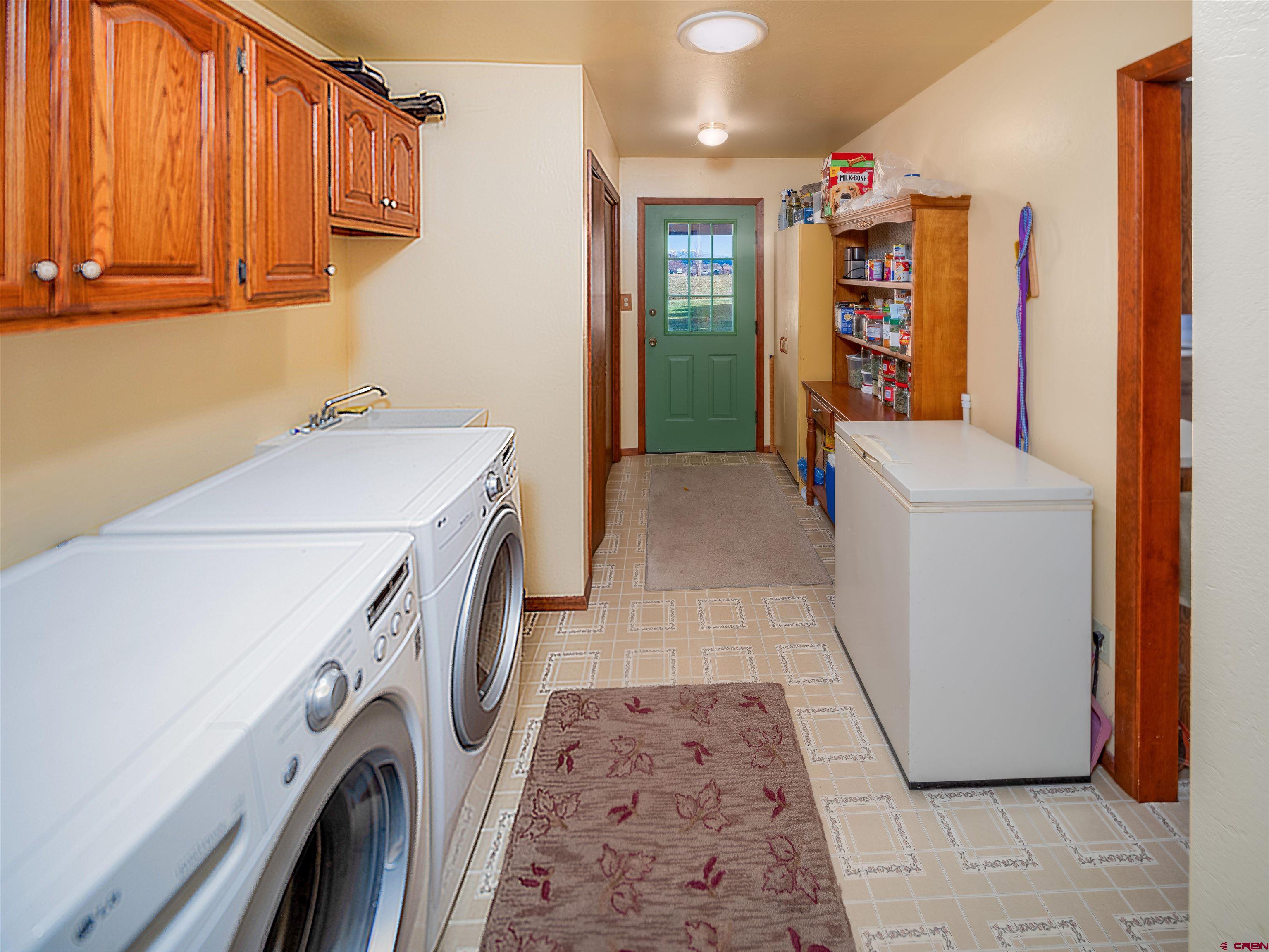 24620 Rd North Cortez, CO 81321 - Photo 26 of 40 a utility room with dryer and washer
