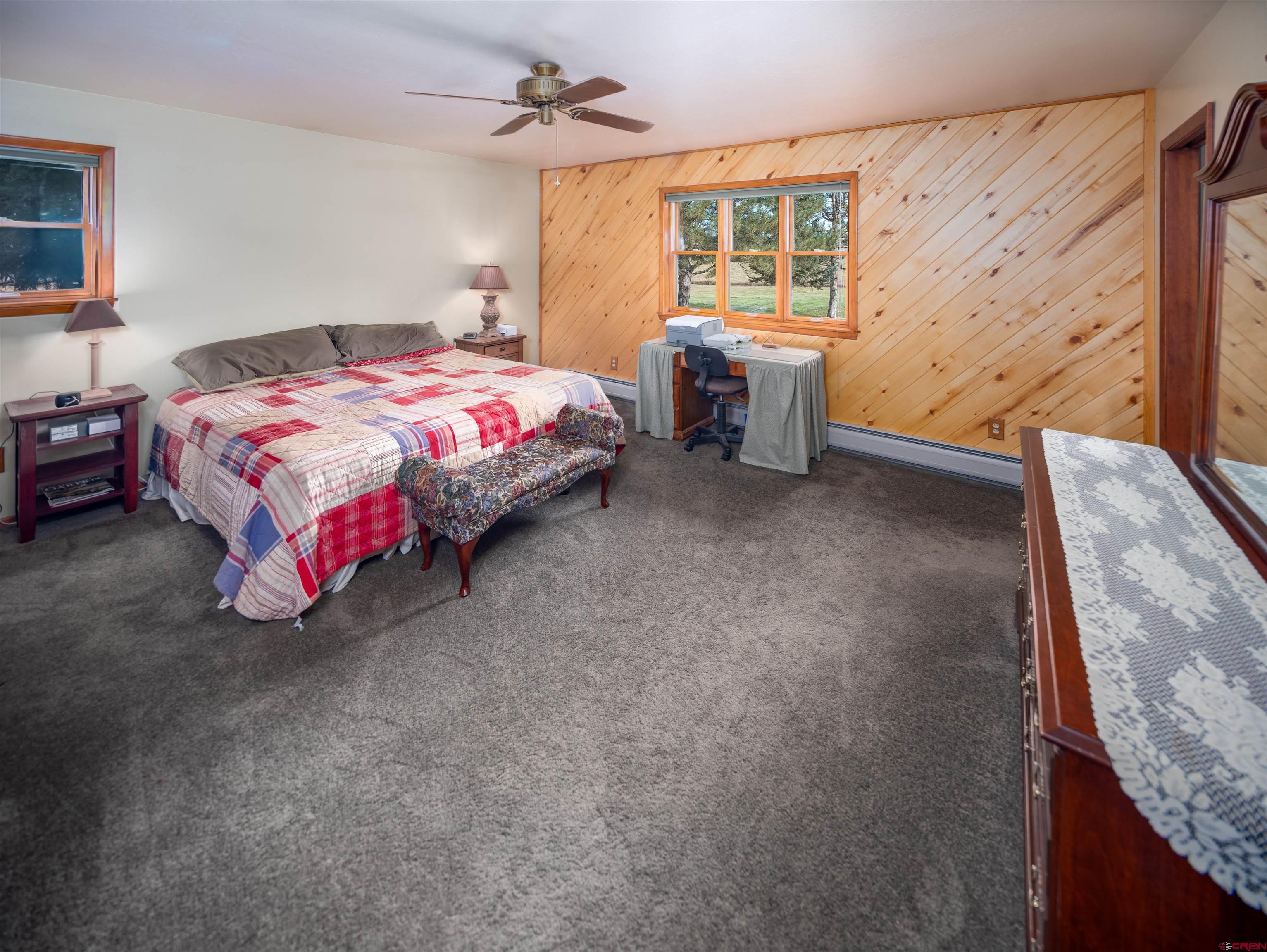 24620 Rd North Cortez, CO 81321 - Photo 28 of 40 a bedroom with a bed and a table