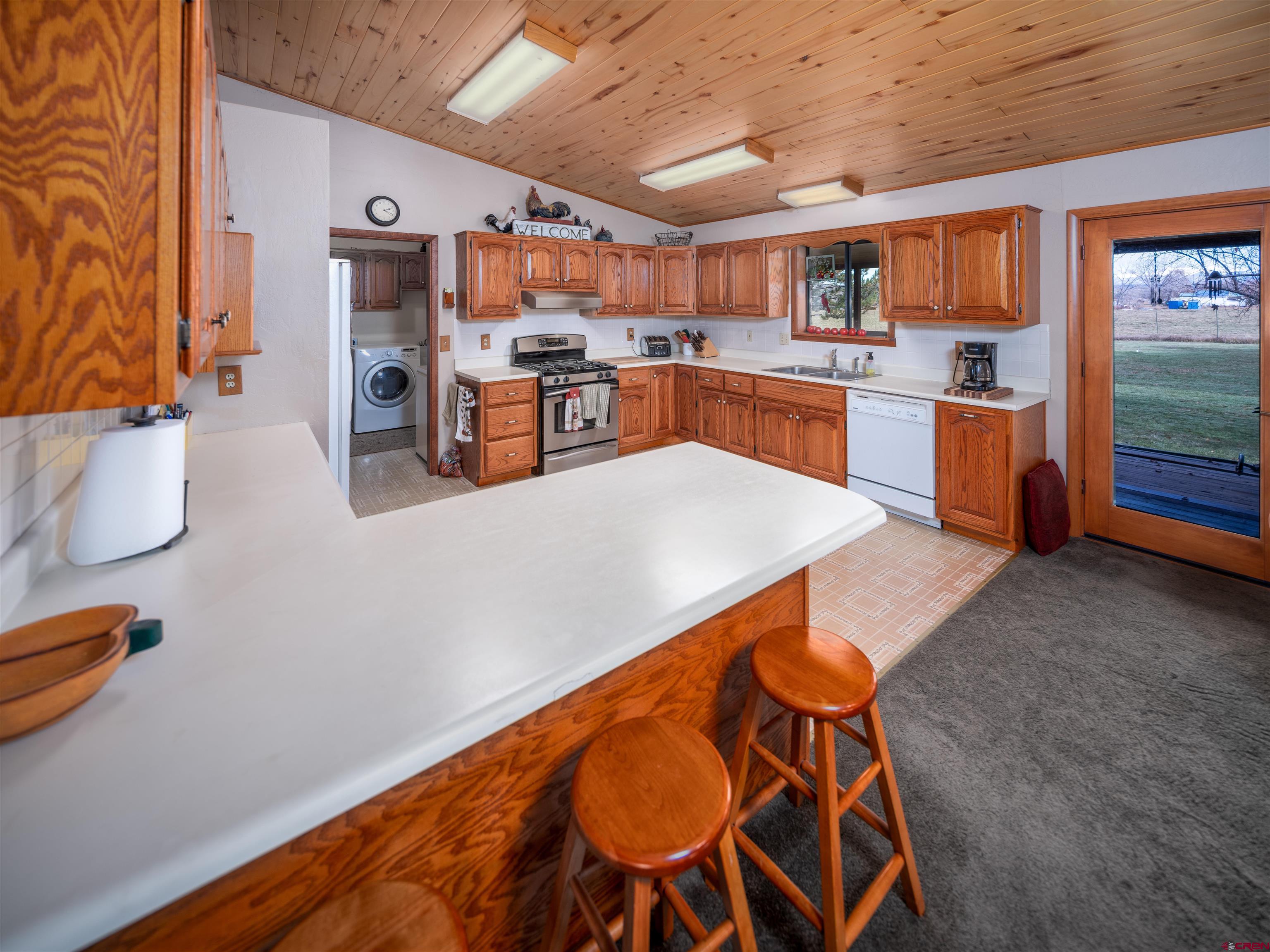 24620 Rd North Cortez, CO 81321 - Photo 31 of 40 a kitchen with stainless steel appliances granite countertop a sink and cabinets