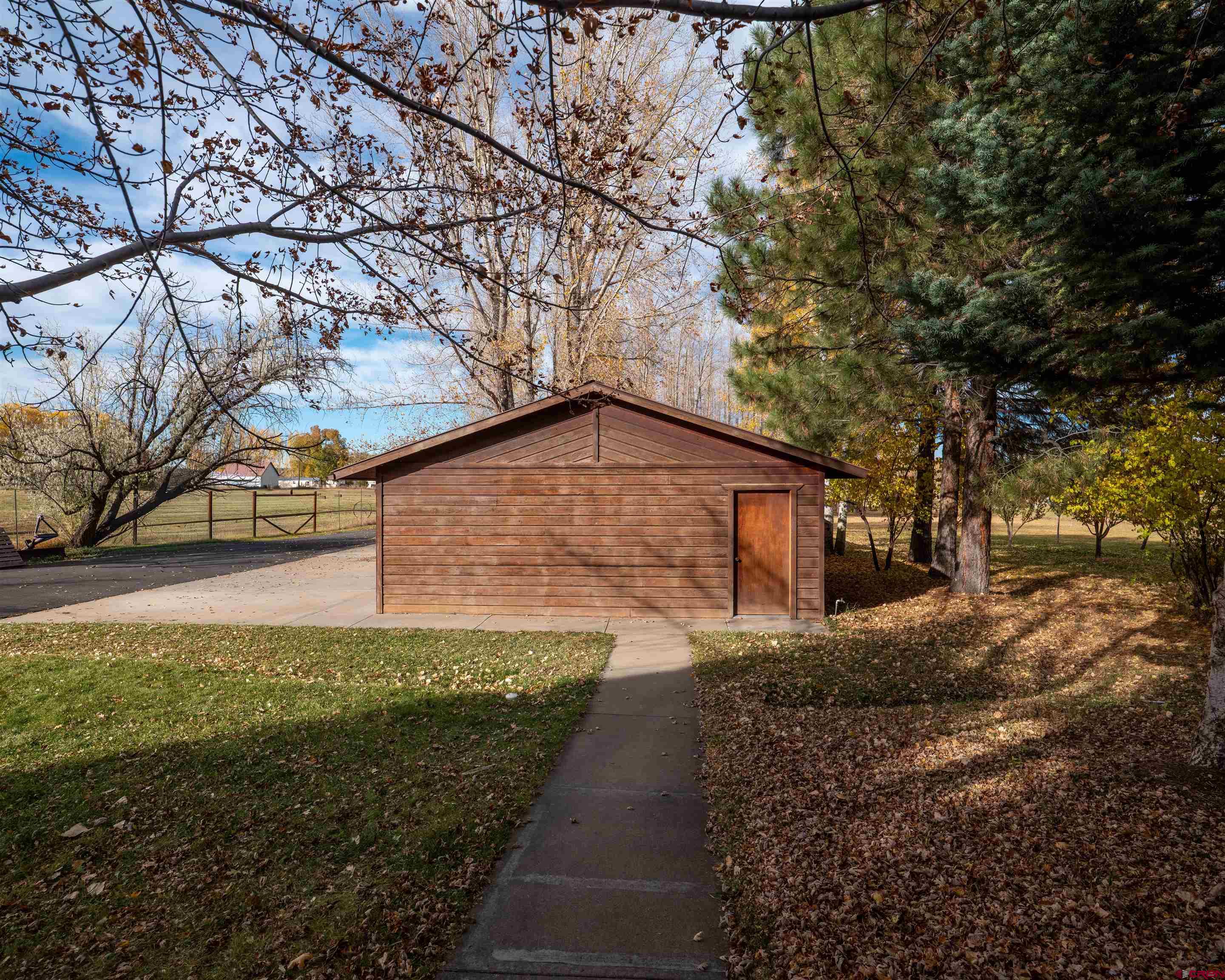 24620 Rd North Cortez, CO 81321 - Photo 36 of 40 a backyard of a house with lots of green space