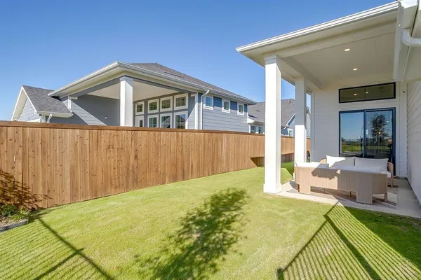 a house view with swimming pool in front of it