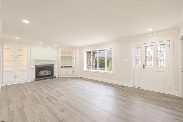 a kitchen with stainless steel appliances granite countertop a stove microwave and cabinets