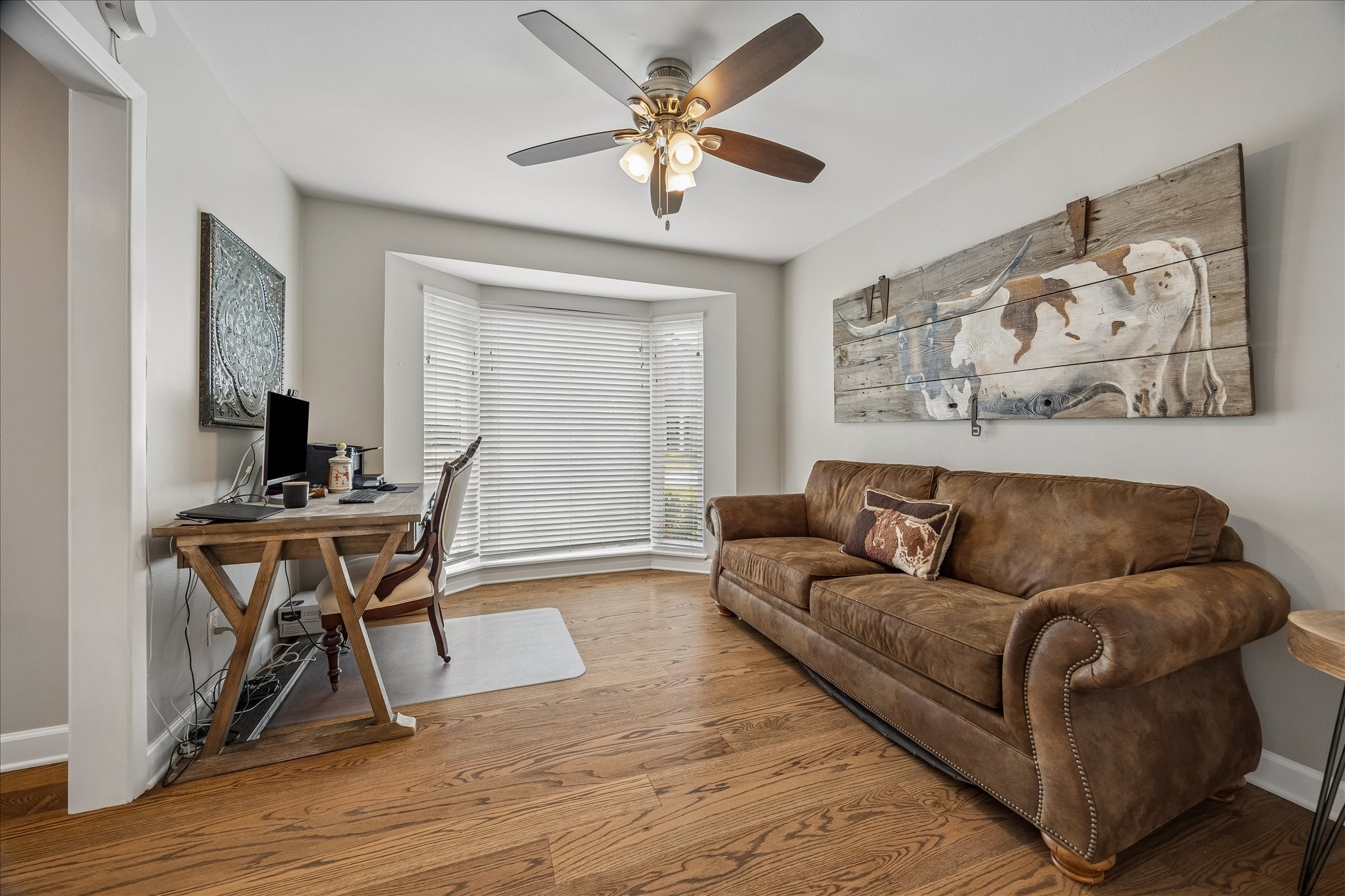1018 Ben Hur Drive Spring Valley Village, TX 77055 - Photo 4 of 30 The flex room/ home office features bay windows, hardwood floors and a ceiling fan.