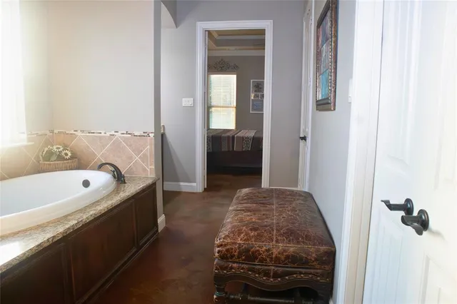 a en suite bathroom with a sink and a tub