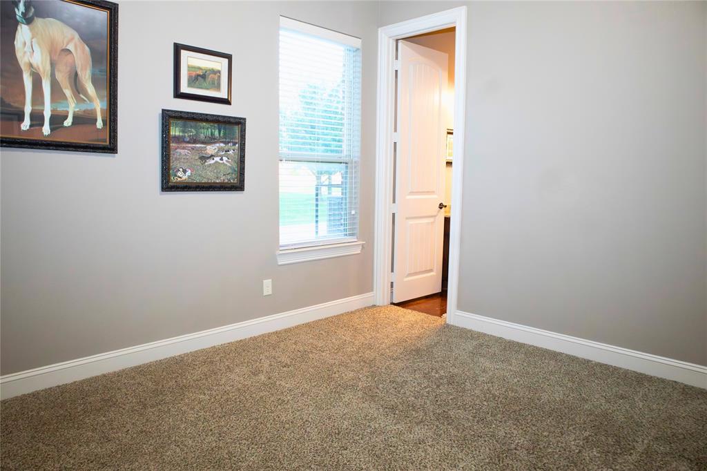 7115 Sussex Lane Mansfield, TX 76063 - Photo 15 of 25 an empty room with windows and closet