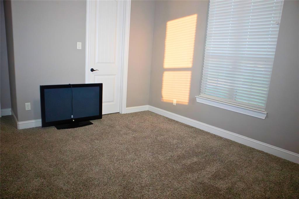 7115 Sussex Lane Mansfield, TX 76063 - Photo 20 of 25 an empty room with windows and closet