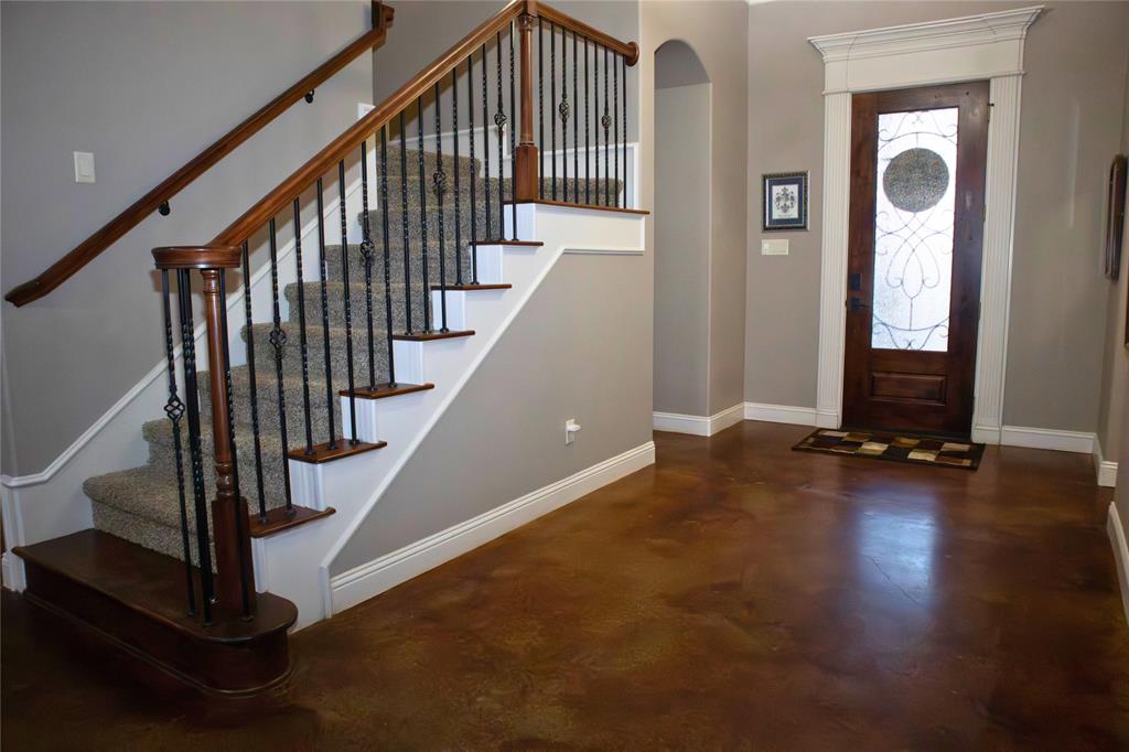 7115 Sussex Lane Mansfield, TX 76063 - Photo 2 of 25 a view of entryway with wooden floor and stairs