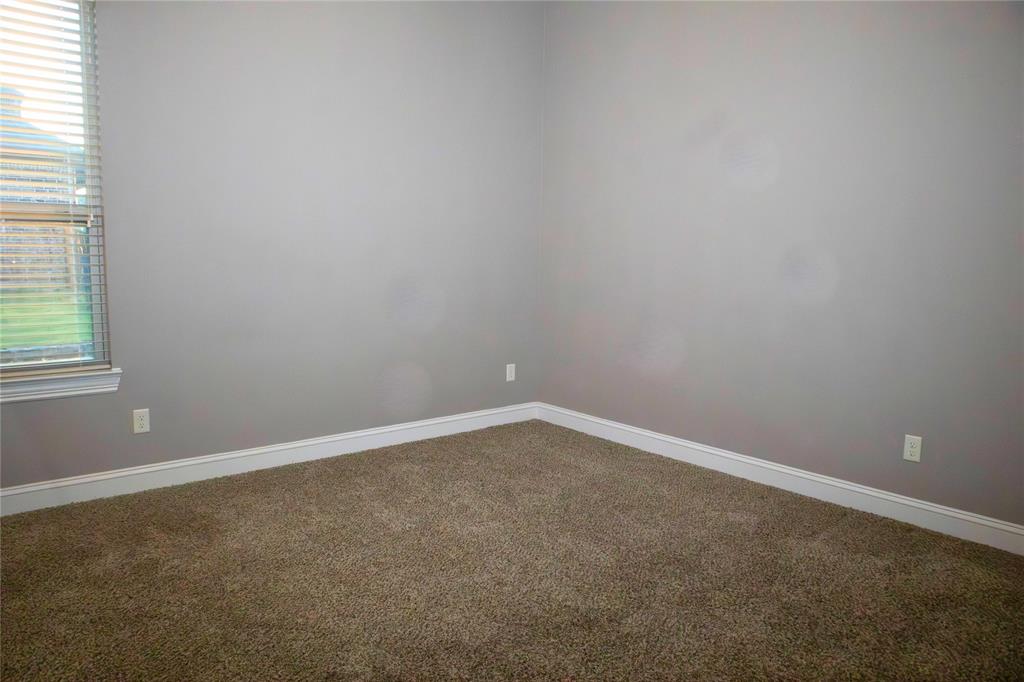 7115 Sussex Lane Mansfield, TX 76063 - Photo 21 of 25 an empty room with a window