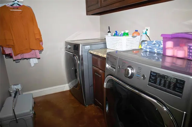 a front view of a house with yard and garage