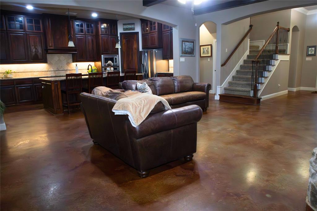 7115 Sussex Lane Mansfield, TX 76063 - Photo 3 of 25 a living room with furniture and a kitchen view