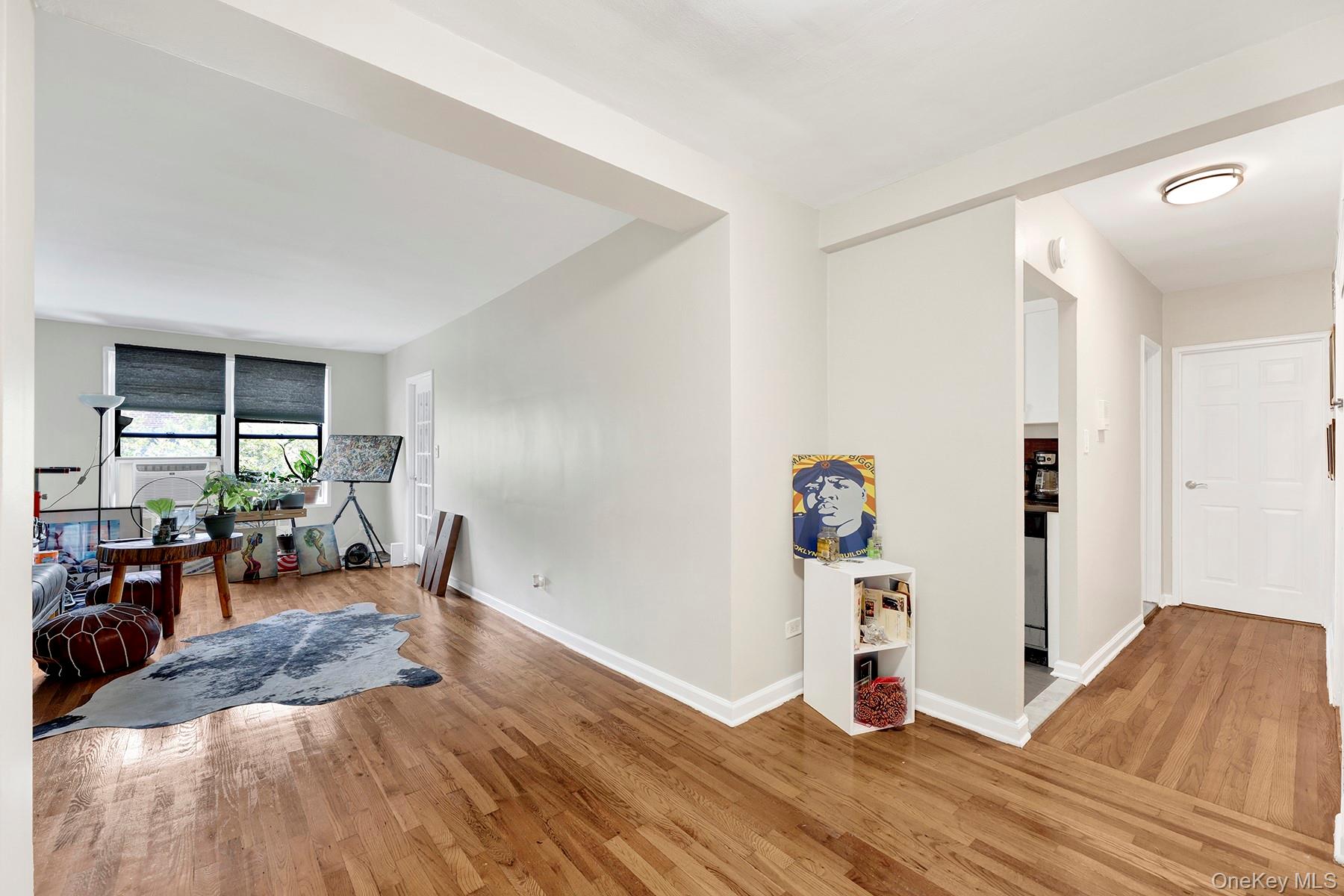 285 East 35th Street, Unit 6E Brooklyn, NY 11203 - Photo 2 of 21 Sitting room with wood finished floors and baseboards