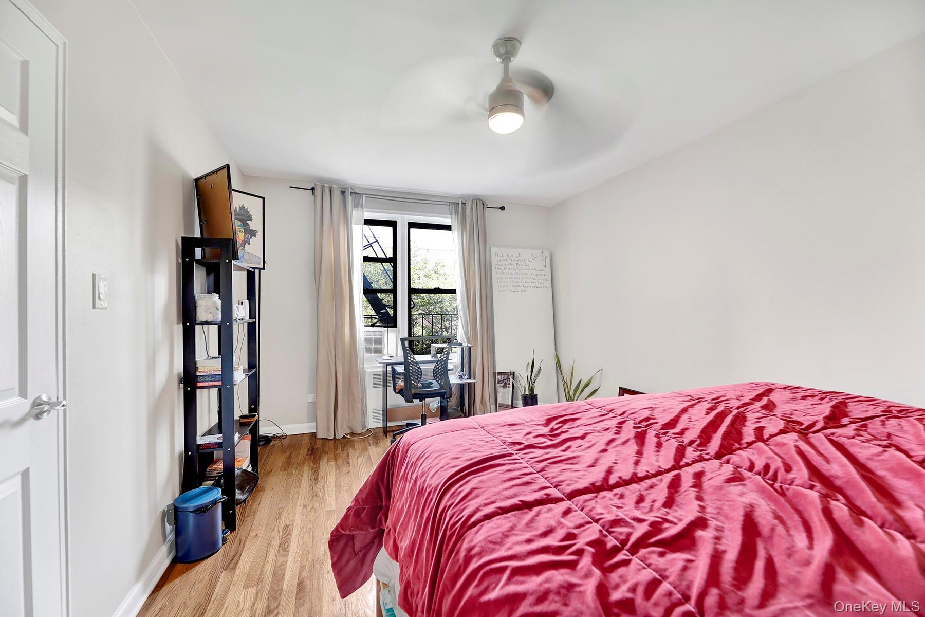 285 East 35th Street, Unit 6E Brooklyn, NY 11203 - Photo 9 of 21 Bedroom featuring light wood finished floors and ceiling fan