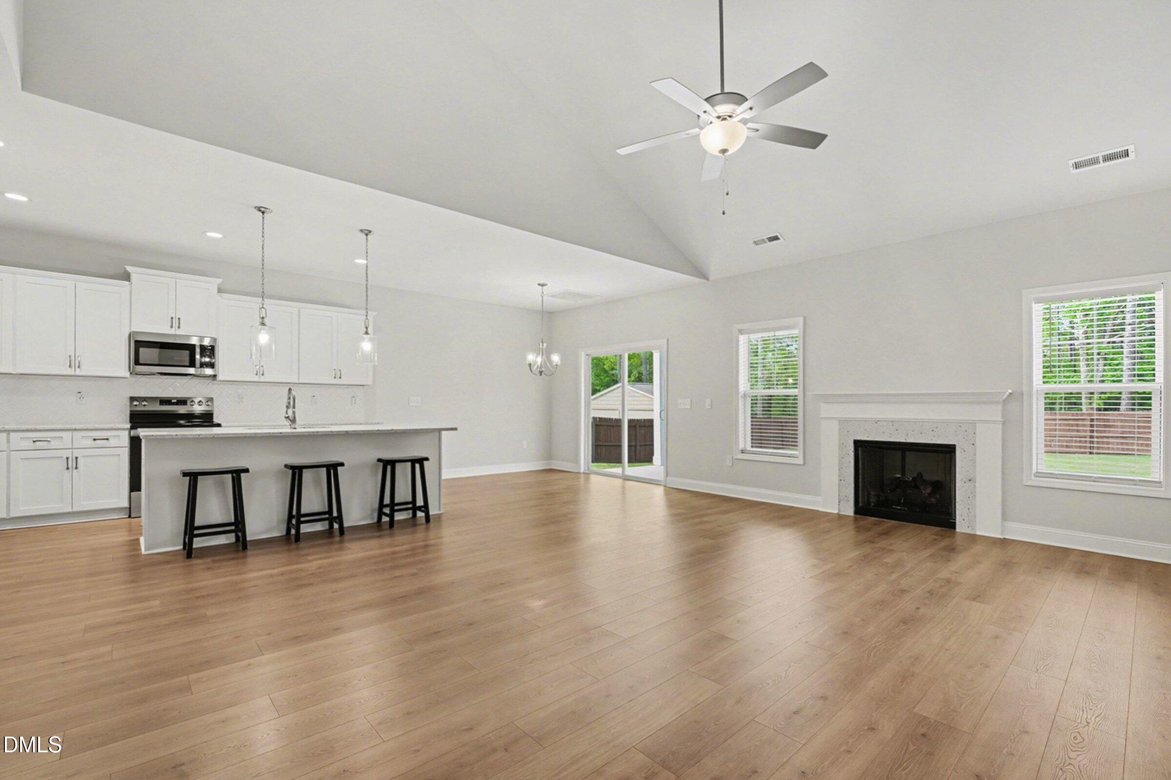 2815 Lemuel Black Road Spring Lake, NC 28390 - Photo 6 of 37 an open kitchen with a table and chairs