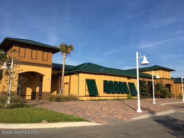 3469 Burrowing Owl Drive Mims, FL 32754 - Photo 27 of 40 a house view with a garden space