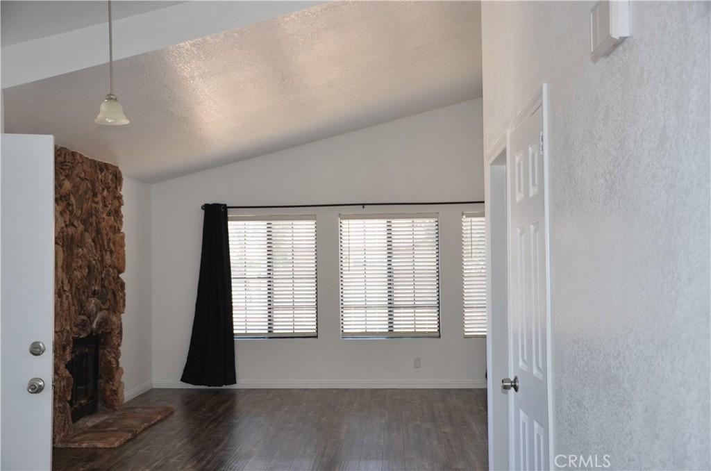 43600 Santa Rosa Circle Lancaster, CA 93535 - Photo 16 of 25 a view of empty room with wooden floor and fan