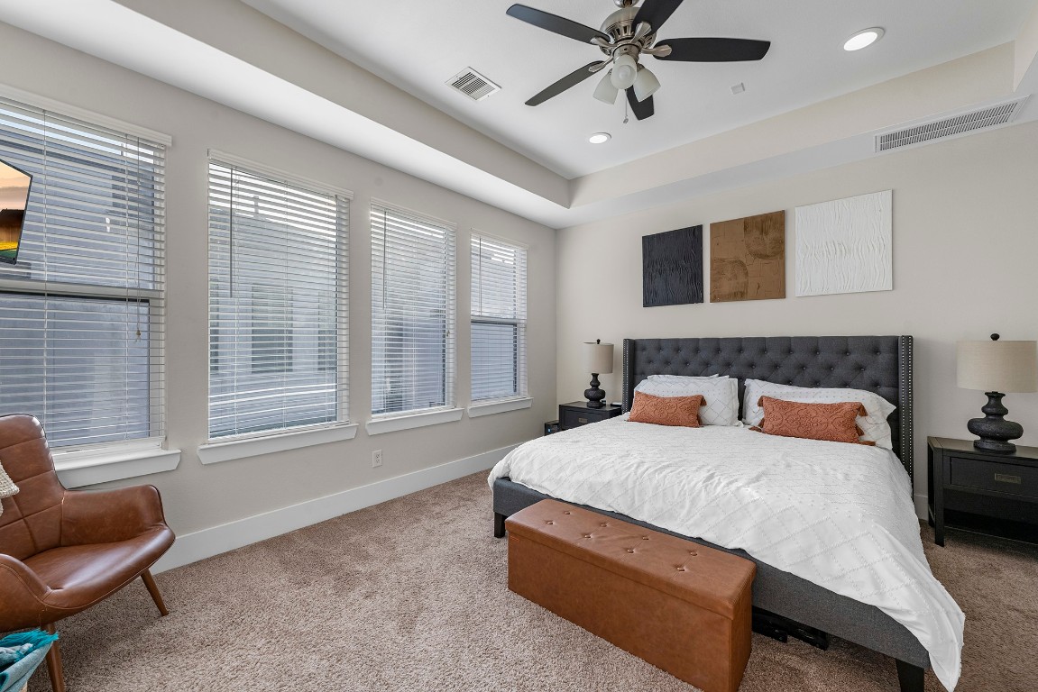 209 Burr Street, Unit D Houston, TX 77011 - Photo 13 of 20 a bedroom with a bed and window
