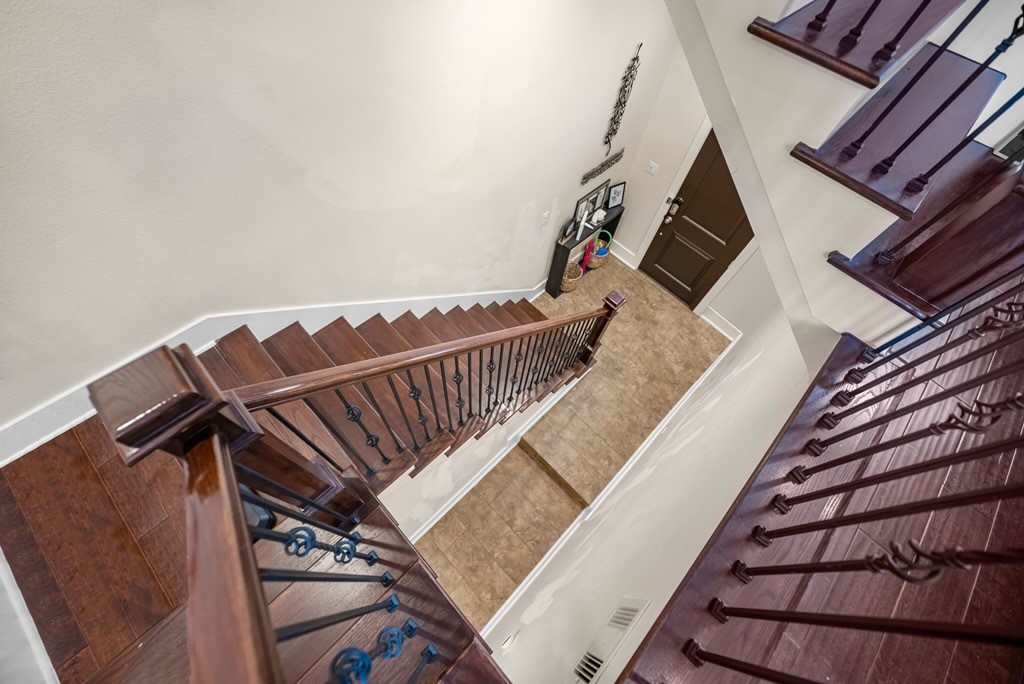 209 Burr Street, Unit D Houston, TX 77011 - Photo 5 of 20 a view of stairs and hall