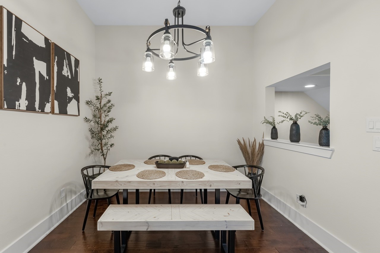 209 Burr Street, Unit D Houston, TX 77011 - Photo 8 of 20 a view of a dining room with furniture and wooden floor