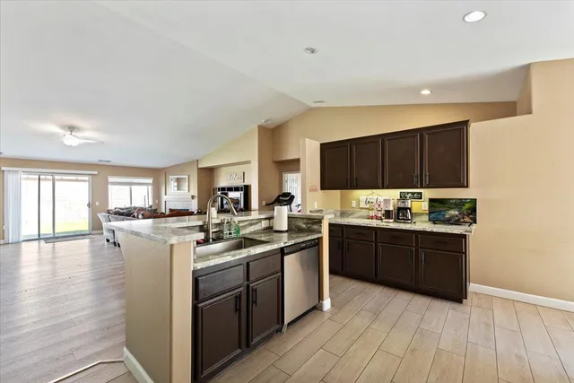 a kitchen with a stove top oven sink and cabinets