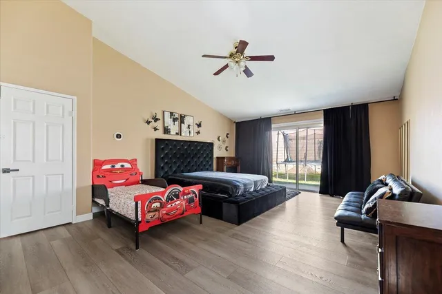 a bedroom with furniture and a window