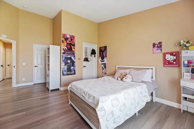 a bedroom with a bed and a table