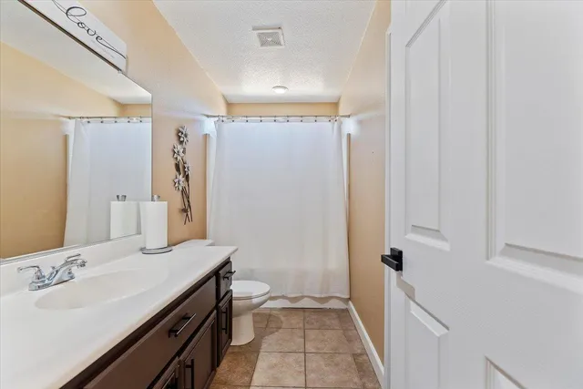 a bathroom with a sink a mirror and a shower