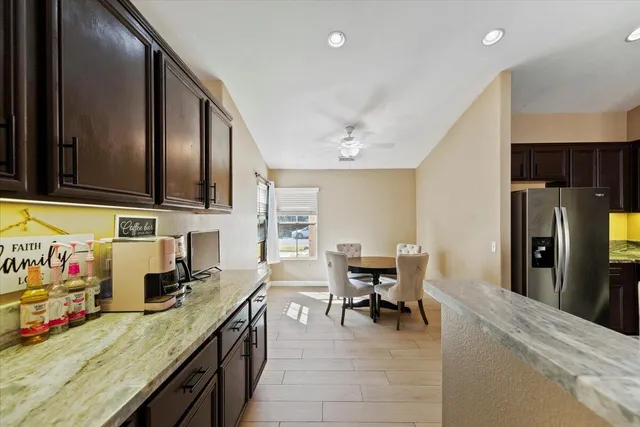 a kitchen with stainless steel appliances granite countertop a sink and cabinets